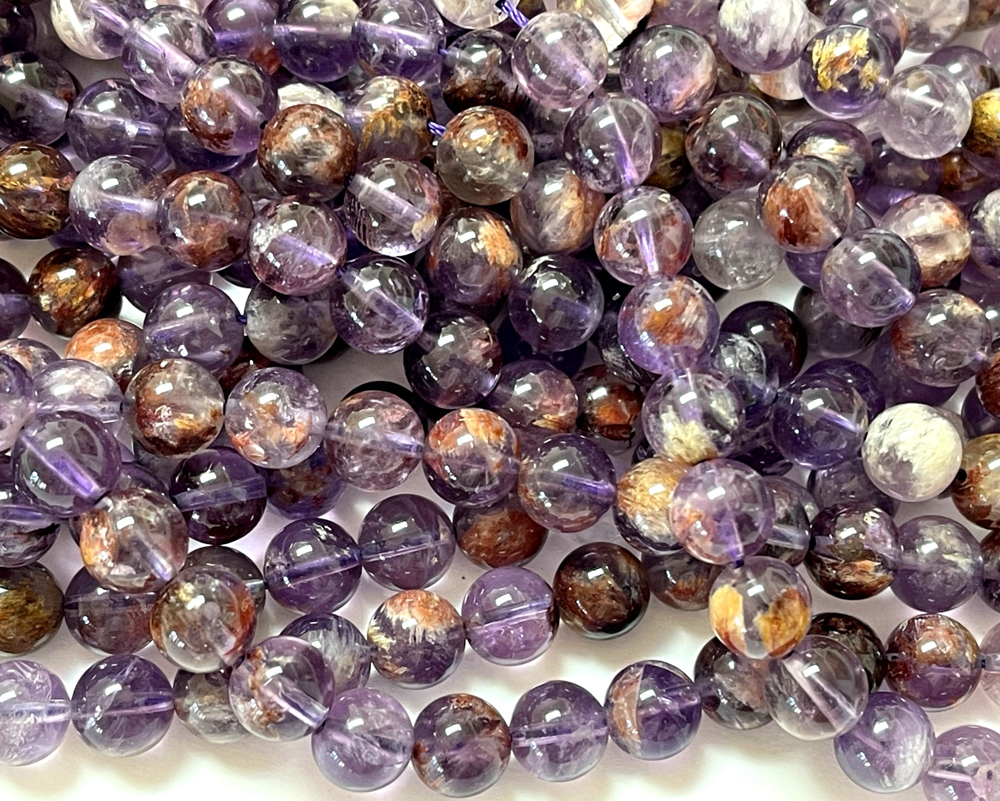 Super Seven Cacoxenite Amethyst 10mm round beads 16" strand