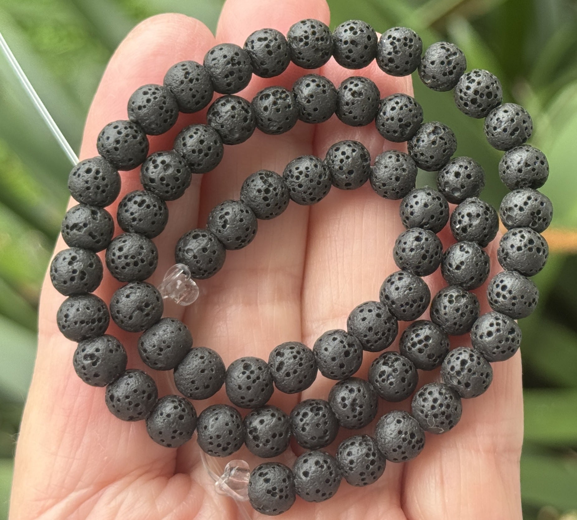 Lava Black porous diffuser beads, 6-10mm, on a 15.5-inch lava bead strand.