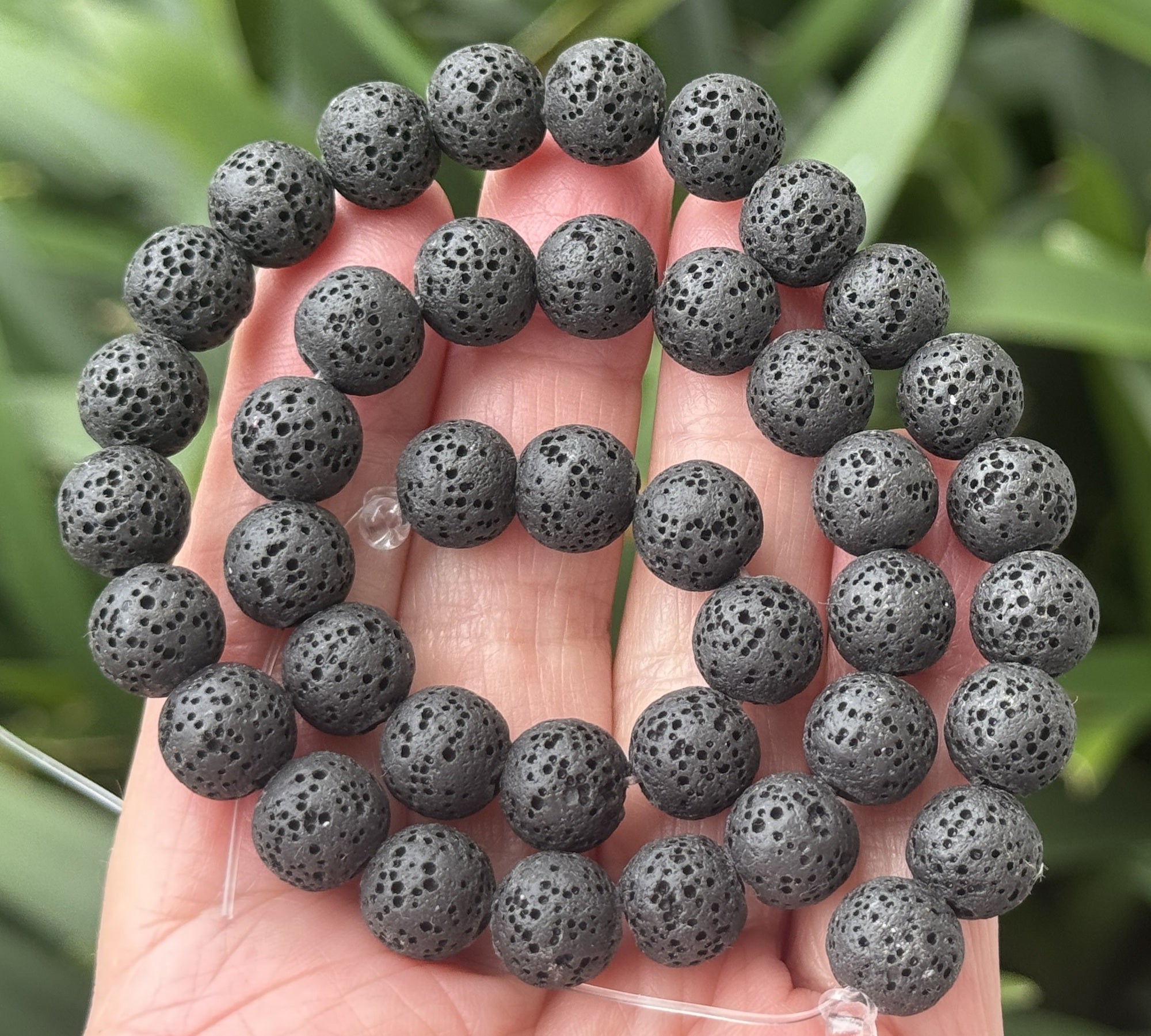Black lava diffuser beads, round natural volcanic lava in 6, 8, 10 mm sizes on a 15.5-inch strand.