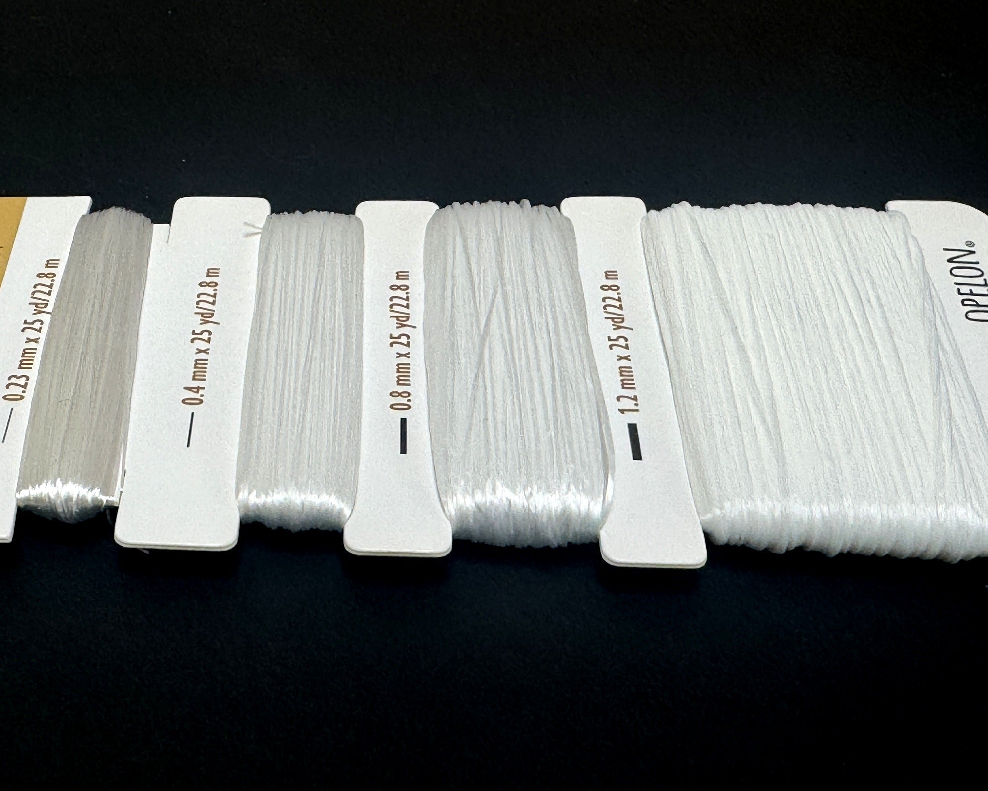 Opelon White Stretch Fiber Cord Variety Pack 4 sizes 22.8 meters each - Oz Beads 